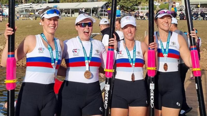 ¬¬Corporal Rachel Cope, left, Flight Lieutenant Lauren Finnerty, Corporal Sarah Leon and Chief Petty Officer Brianna Murray celebrate winning bronze at the Australian Masters Rowing Championships.