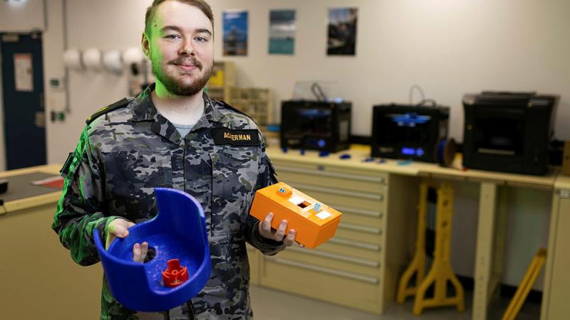 Able Seaman Electronics Technician, Weapons, Dillan Ackerman, showcases 3D printed engineering parts at Fleet Support Unit, South East Sydney. 