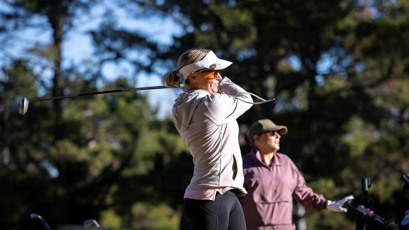 Warrant officer Class Two Yolanda Groenewoud participates in a game of golf to close out a clinic held by the ACT ADF Golf Association at the Royal Military College - Duntroon, in Canberra. 