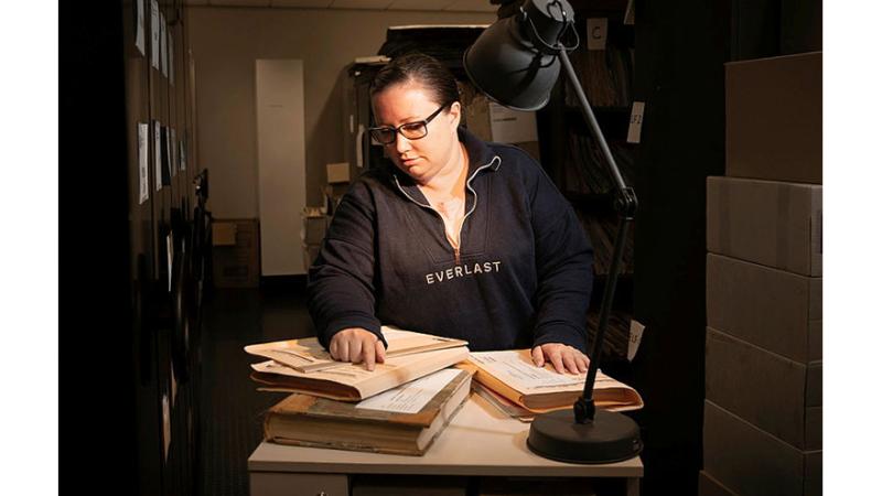Ms Nikki Dohnt from the Military Police Central Records Office sorts through archives.