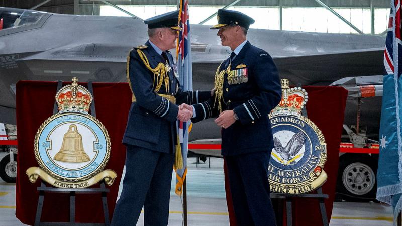 Royal Air Force Chief of the Air Staff Air Chief Marshal Sir Rich Knighton and Royal Australian Chief of Air Force Air Marshal Robert Chipman shake hands at the 80 Squadron reformation ceremony at Eglin Air Force Base, Florida. 