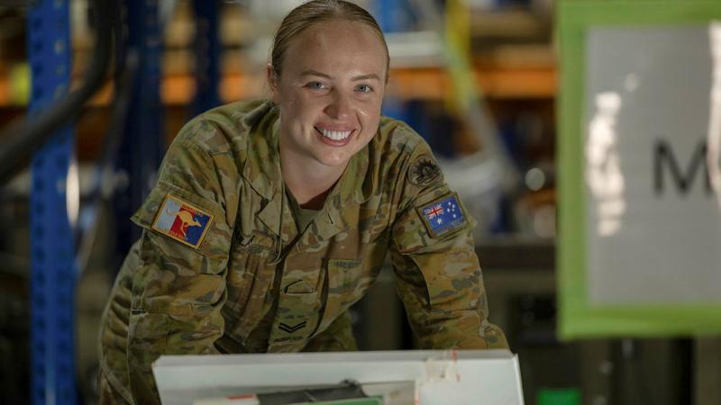 Corporal Danielle Laidlaw at work in a warehouse at Australia’s main operating base in the Middle East.