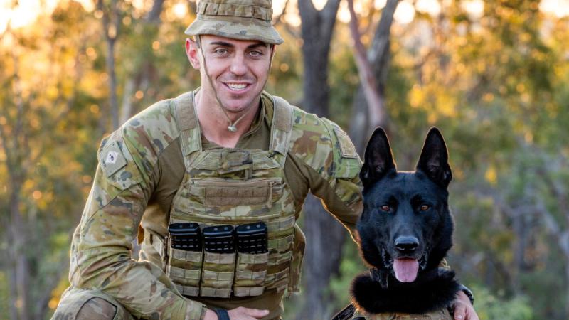 Lance Corporal Jared Willis and military police dog, Dirk, of 1st Military Police Battalion, during the Military Working Dog Basic Course at RAAF Base Amberley, Queensland.