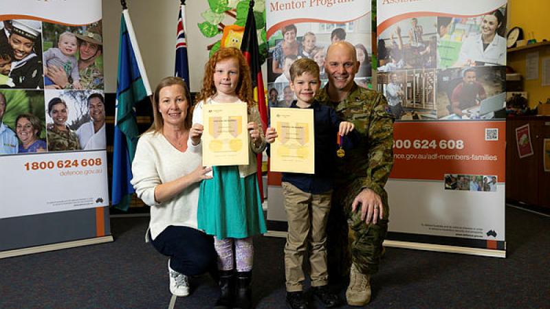 Army chaplain Major Joshua Bouzanquet, his wife Sybille and their two children, during the Child of ADF Medallion presentation at Royal Military College - Duntroon, Canberra. 