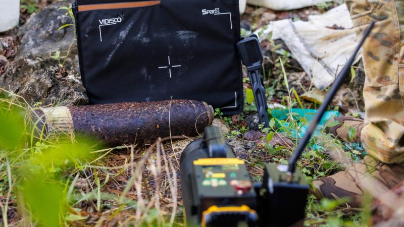 Explosive ordnance disposal specialists from Australia and the US conduct x-ray procedures to determine the safety state of explosive remnants of war during Operation Render Safe in Nauru. 