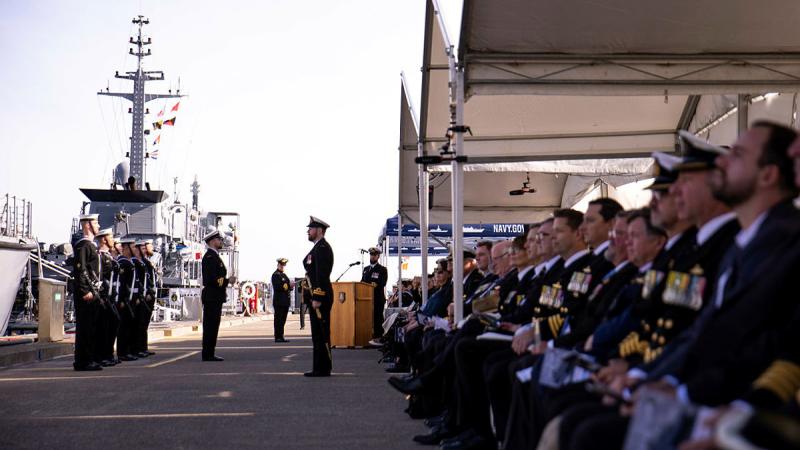 Current and former crew members of HMAS Huon gather for the ship's decommissioning ceremony at HMAS Waterhen, NSW. 