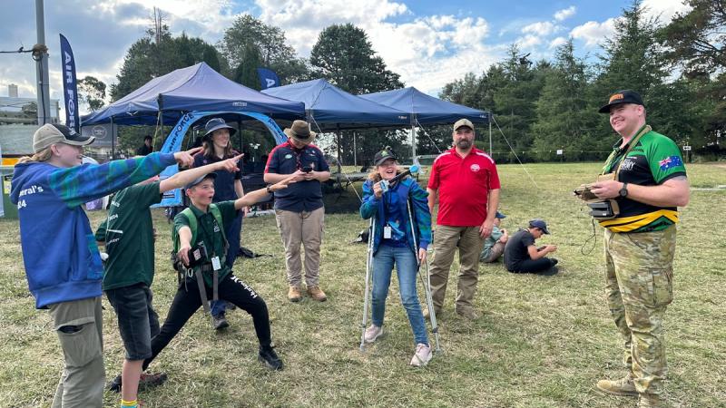 Army drone racing pilot, Captain Chris Payne demonstrates the Black Hornet to scouts during the 2024 Governor-General's Scout Camp at Government House.