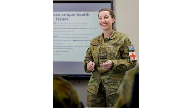 Flight Lieutenant Tara Kinnane chats to Defence personnel about women’s health at RAAF Base Amberley.