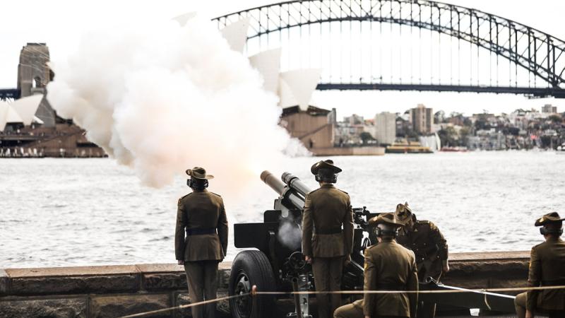 rmy soldiers from 7th Light Battery within 9th Regiment, Royal Regiment of Australian Artillery, fire a 21-gun salute for the King's birthday at Fleet Steps, near the Royal Botanic Gardens in Sydney