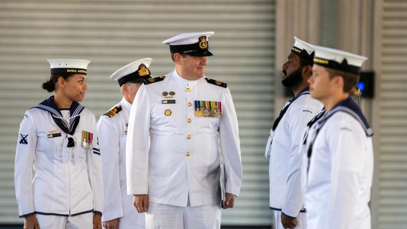Reviewing Officer of the Navy’s Indigenous Development Program graduation ceremony, Warrant Officer of the Navy, Warrant Officer Andrew Bertoncin reviews the graduate recruits at HMAS Cairns.
