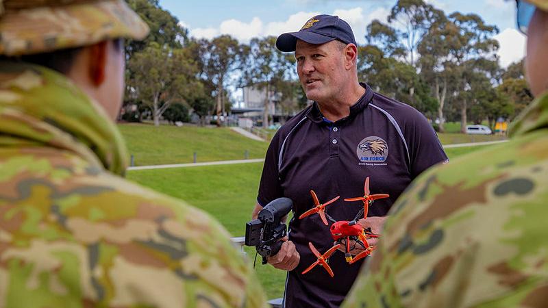 Royal Australian Air Force aviator, Flight Sergeant Justin Galbraith from the Royal Australian Air Force Drone Racing Team talks about drones with Australian Army Cadets during the Nationals Qualifier held at Simpson Barracks, Victoria.