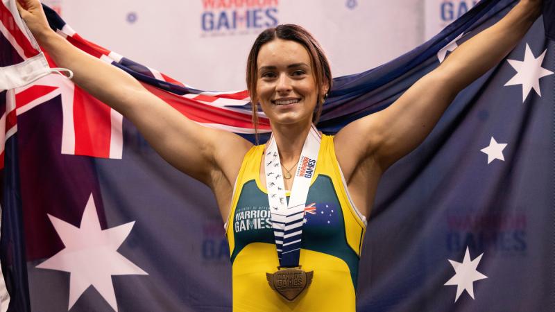 Warrior Games 2024 Team Australia competitor Erin Brigden celebrates winning gold during the women’s 73.01-79.0kg powerlifting event at the ESPN Wide World of Sports Complex, Florida, US. 