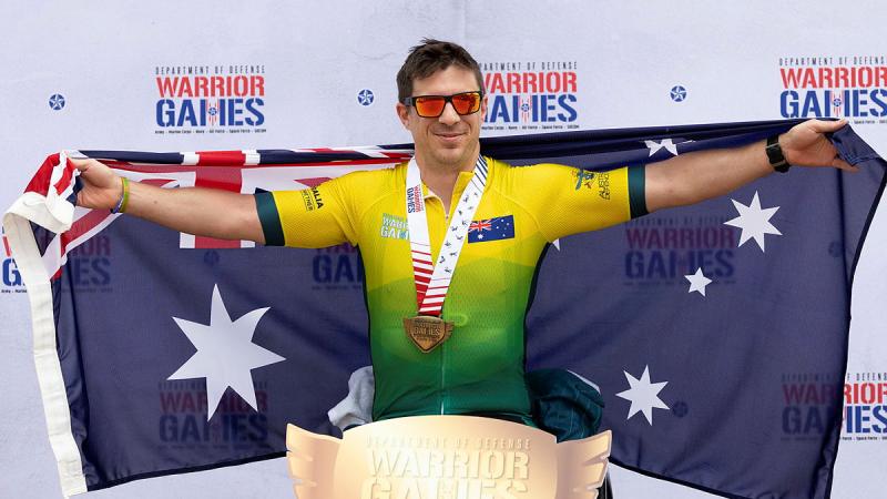 Lieutenant Commander Dave Miln celebrates winning gold in his recumbent road race during the Warrior Games at the ESPN Wide World of Sports Complex in Orlando, Florida. Photo: Flight Sergeant Ricky Fuller