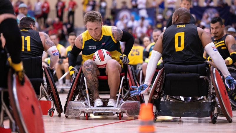 Warrior Games 2024 Team Australia competitor Leading Seaman Harley Dodds attacks the try line during a wheelchair rugby match against Team Army at the ESPN Wide World of Sports Complex, Florida, US. 