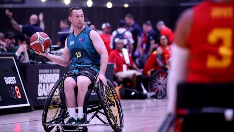 Jamie Smyth prepares to pass the ball during their wheelchair basketball game against the United States Army at the Warrior Games 2024, held in Orlando, Florida, USA. Photo: Flight Sergeant Christopher Dickson.