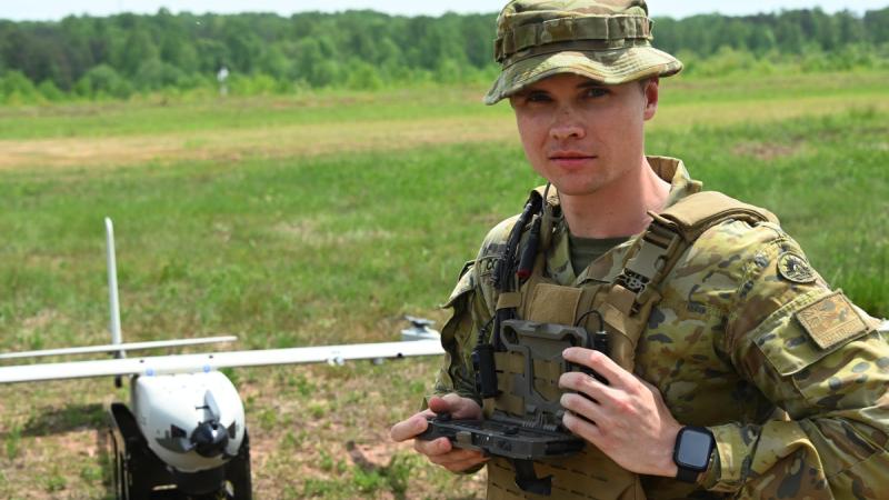 Australian Army officer Lieutenant Brandon Colelough wearing the Radio Agile Integrated Device tactical mission kit. 