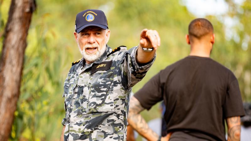 Commander Michael Henry (here a Lieutenant Commander) sets up camp during an Indigenous immersion event in Baniyala, Northern Territory in 2023