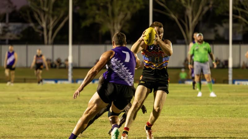 The NT men's Police Fire and Emergency Services attempt to gain possession off the Australian Defence Force team at the ANZAC Shield IV.