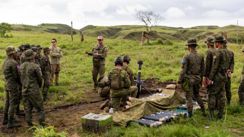 Australian Army Corporal David Scott from the Joint Australian Training Team – Philippines, briefs personnel from the Philippine Army during an all arms call for fire training serial.