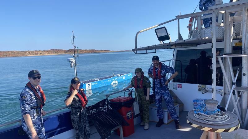 Sergeant Hannah Freeman and Flying Officer Jack Tucker (right) join other aviators on a Navy-led innovation voyage on commercial vessel MV Offshore Solution.