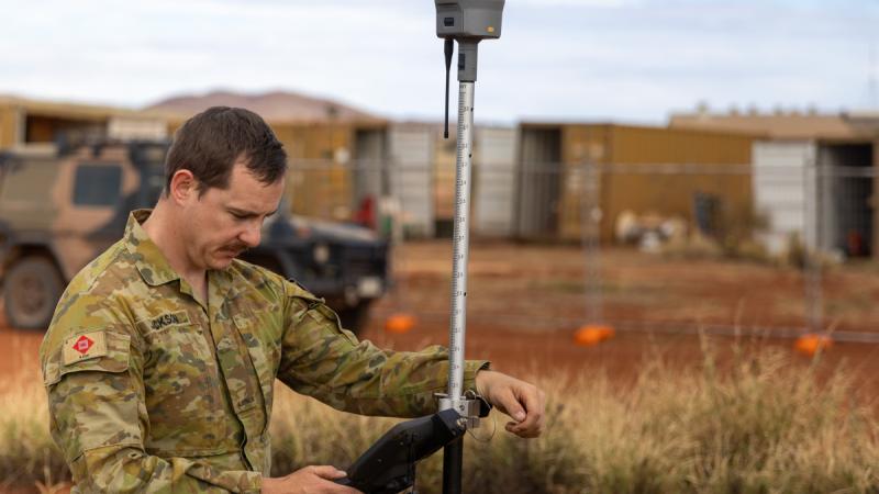 Australian Army surveyor Sapper Shaun Jackson from 6th Engineer Support Regiment completes a surveying task as part of the 2024 Army Aboriginal Community Assistance Programme in Amata, SA.