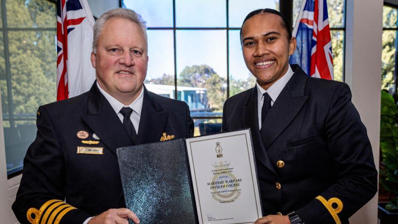 Director Training Authority – Maritime Warfare, Captain Ren Reilly, RAN presents Sub Lieutenant Ofeina Unaloto Ki Anisi with her Maritime Warfare Officers Course graduation certificate at HMAS Watson, Sydney , NSW. Photos: Leading Seaman Iggy Roberts