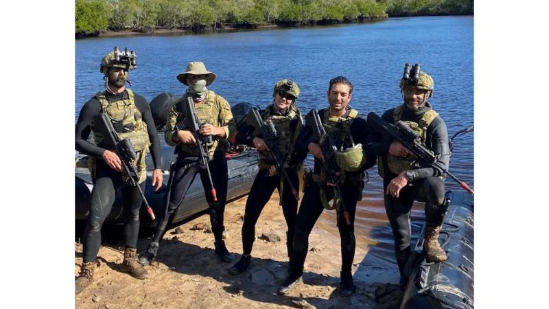  Navy Clearance Diving Team Four after a successful boat lane clearance in Kauri Creek, Queensland.