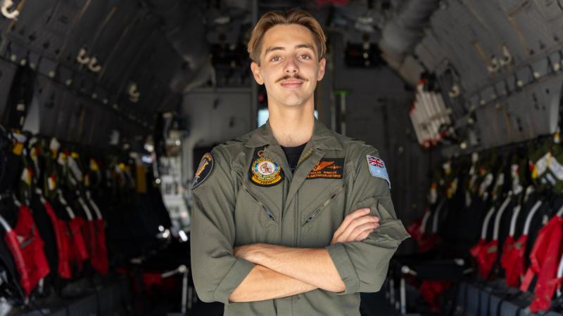 Corporal Nicholas Winkler, a loadmaster from 35 Squadron, inside an Air Force C-27J Spartan at RAAF Base Amberley, Queensland. 