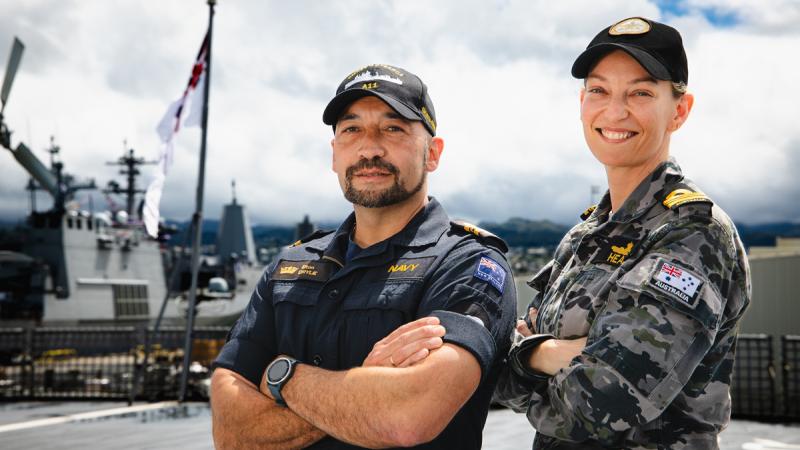 Lieutenant Commander Kimberley Healy, principle warfare officer from Sea Combat Command alongside New Zealand Navy Lieutenant Commander Elton Drylie aboard HMNZS Aotearoa during Exercise Rim of the Pacific 2024, at Joint Base Pearl Harbor-Hickam, Hawaii.