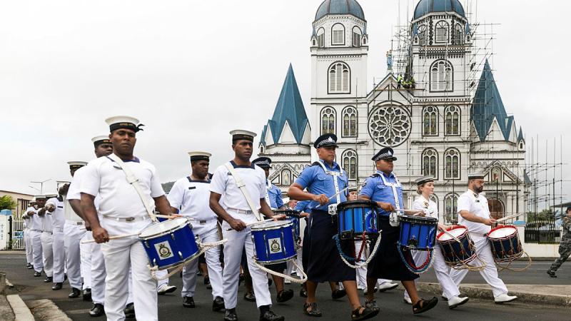 Members of the Republic of Fiji Navy band, Royal Samoa Police band and the Royal Australian Navy band take part in the daily Samoa Police Service march in Apia, as part of a South West Pacific Regional Presence Deployment.