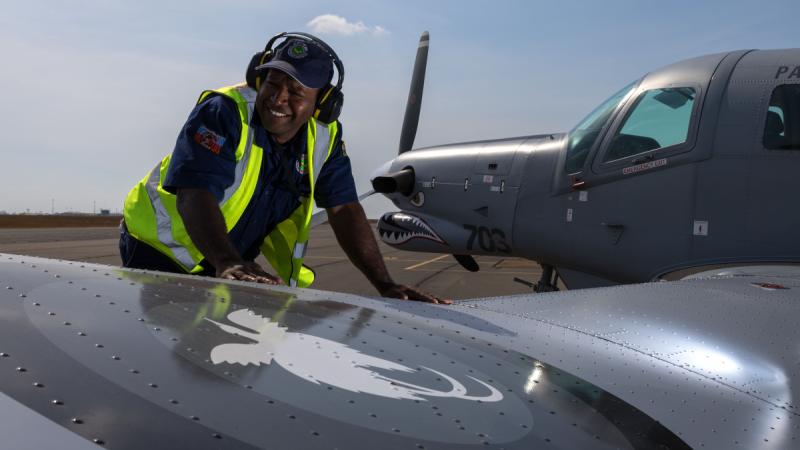 Joshua Magun, of Air Transport Wing, inspects a Papua New Guinea Defence Force PAC P-750XL prior to a sortie during Exercise Pitch Black. 