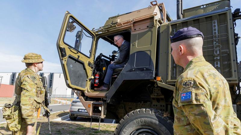 Director of Exercise Austral Shield 2024 Brigadier Damian Hill, right, watches as Comcare director Peter Davies is shown over an Army vehicle at HMAS Harman, near Canberra. Photo: Corporal Cameron Pegg