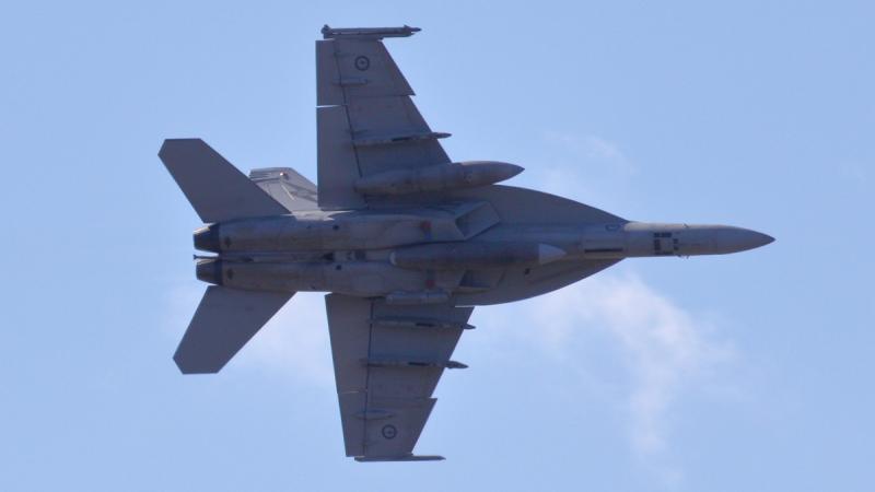 A F/A-18F Super Hornet from No. 1 Squadron conducts a low-level flypast over Cairns Esplanade, enthralling the local community during Exercise Crimson Dawn.