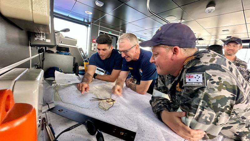 A team from the U.S. Coast guard and Royal Australian Navy considers mooring locations offshore Guam on June 5. 