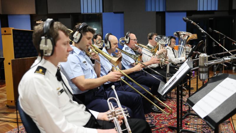 Members from the Royal Australian Navy Band and the Royal Australian Air Force Band play their instruments during the recording of the ADF Careers anthem.