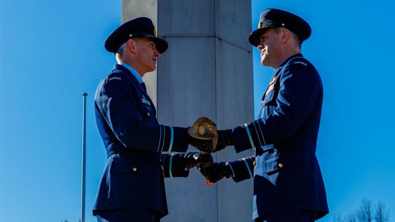 Outgoing Chief of Air Force, Air Marshal Robert Chipman, presents incoming Chief of Air Force, Air Marshal Stephen Chappell, with the original sword worn by Sir Richard Williams during a Change of Command Parade on Sir Thomas Blamey Square, Canberra. Photo: LAC Ryan Howell