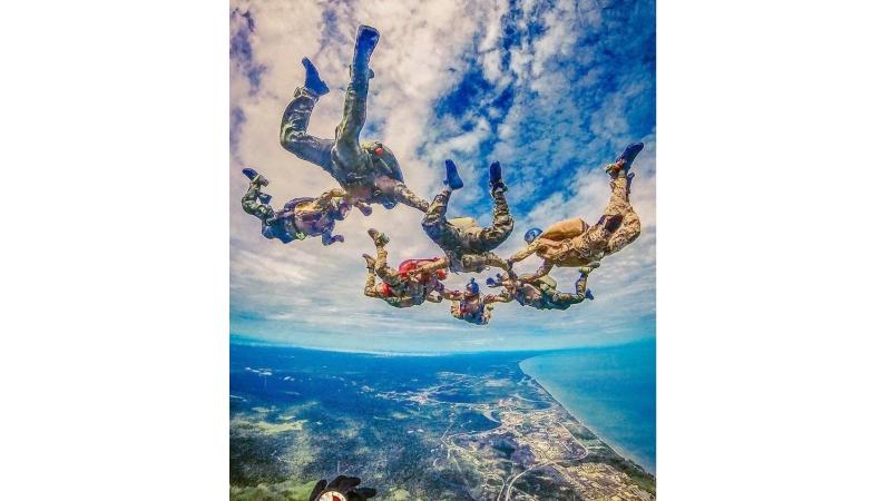 Members of Special Operations Command conduct a military free fall during Royal Brunei Armed Forces Day 2024 in Brunei.