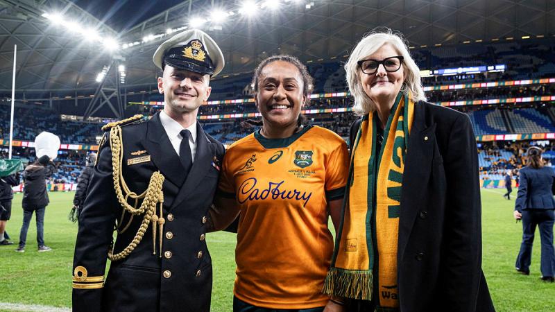 Wallaroos player Leading Seaman Lydia Kavoa, centre, with Governor-General Sam Mostyn and Lieutenant Beau Taylor.