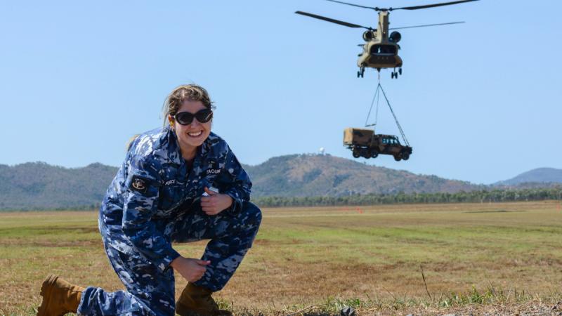 Flying Officer Rosemary Taouk observes the G-Wagon External Lift Trials, where the G-Wagon is hooked-up to the CH-47F Chinook for external carriage. 