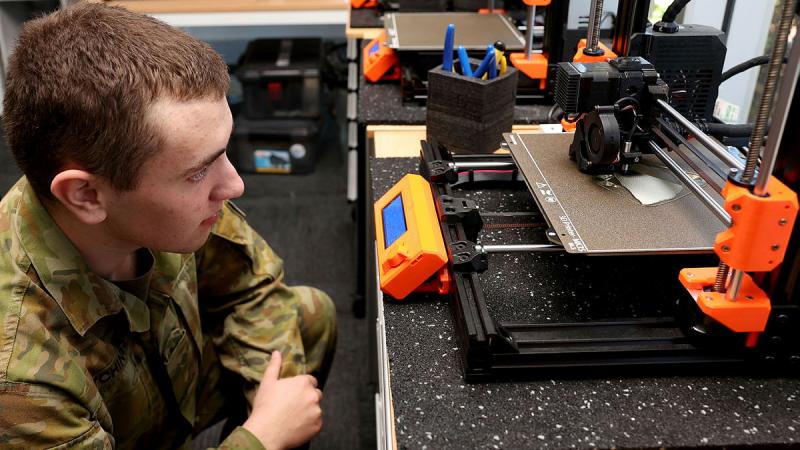  Army Craftsman Ben Hutchings watches as a 3D printer produces an object at the MakerSpace workshop on Latchford Barracks. 