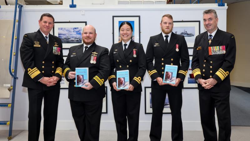 Chief of Navy, Vice Admiral Mark Hammond, AO, RAN (far left) and the Director General of the Australian Submarine Agency Vice Admiral Jonathan Mead, AO, RAN (far right), with Australia's first Navy officers to graduate from the Royal Navy's Nuclear Reactor Course: Lieutenant Commander James (second from left) Lieutenant Isabella (centre) and Lieutenant Stephen (second from right). read less
