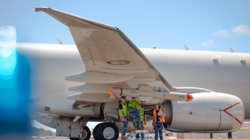 Air Force aviators from No. 11 Squadron fit a AGM-84J harpoon anti-ship missile to a Royal Australian Air Force P-8A Poseidon as part of Exercise Rim of the Pacific (RIMPAC) 2024, Hawaiian Islands.