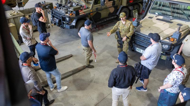 Army soldier Sergeant Nathan Reinbott from 11th Combat Service Support Battalion talks to Army Reserve employers during their visit to Porton Barracks in Cairns, Queensland, as part of Exercise Austral Shield 2024.