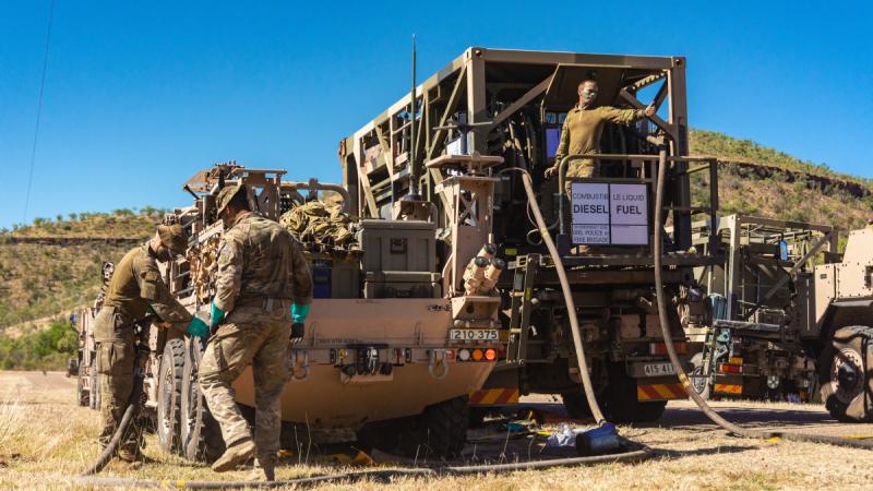 Australian Army fuel specialists from the 1st Combat Service Support Battalion work alongside petroleum operators from UK's Commando Logistics Regiment to refuel Battle Group Tiger vehicles at Timber Creek, Northern Territory, during Exercise Predators Run 2024. Photos: Corporal Madhur Chitnis
