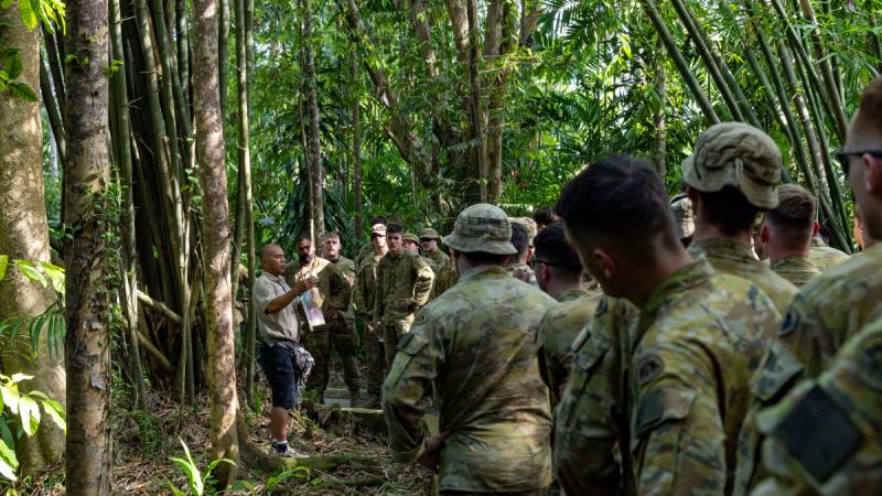 Army soldiers from Rifle Company Butterworth Rotation 144 receive a historical briefing prior to conducting the Sandakan Death March in Sandakan, Malaysia.