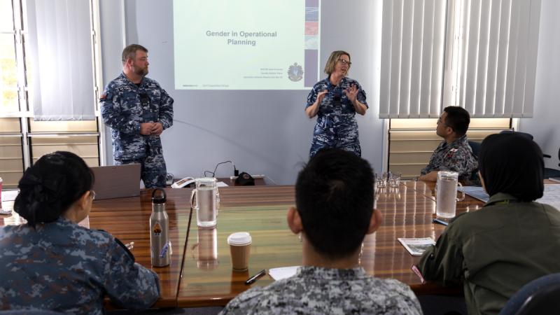 Wing Commander Garth Andrews and Wing Commander Jade Deveney welcome participants to the presentation on Gender, Peace and Security during Exercise Pitch Black 24. 
