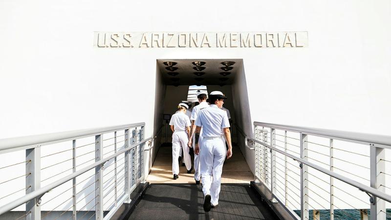 HMAS Sydney personnel walk on board the USS Arizona memorial at Pearl Harbor, Hawaii, during Exercise RIMPAC. Photos: Leading Seaman Daniel Goodman