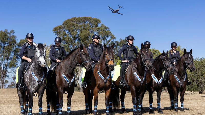 The Queensland Mounted Police Unit members conduct training exercises at RAAF Base Amberley to expose their horses to jet noise in preparation for Brisbane’s Riverfire.