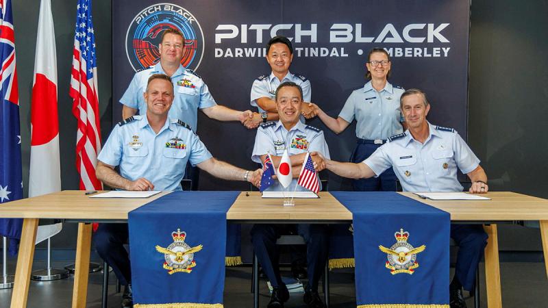 Chief of Air Force Air Marshal Stephen Chappell, Japan Air Self-Defence Force Chief-of-Staff General Hiroaki Uchikura and Commander Pacific Air Forces General Kevin Schneider shake after signing a Memorandum of Intent during Exercise Pitch Black 2024 in Darwin.