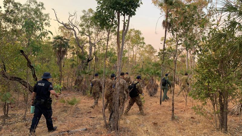 ADF's North-West Mobile Force soldiers, Italian aviators and RAAF Security Forces join NT police for a search at first light for the Italian Typhoon near Daly River.